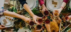 Toasting with wine around a holiday table